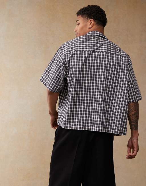 ASOS DESIGN boxy oversized camp collar shirt in navy plaid with chest embroidery