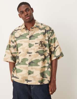 asos ASOS DESIGN boxy oversized shirt with chest embroidery in camo print