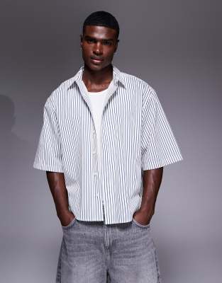 ASOS DESIGN boxy oversized shirt with dipped hem in blue pinstripes