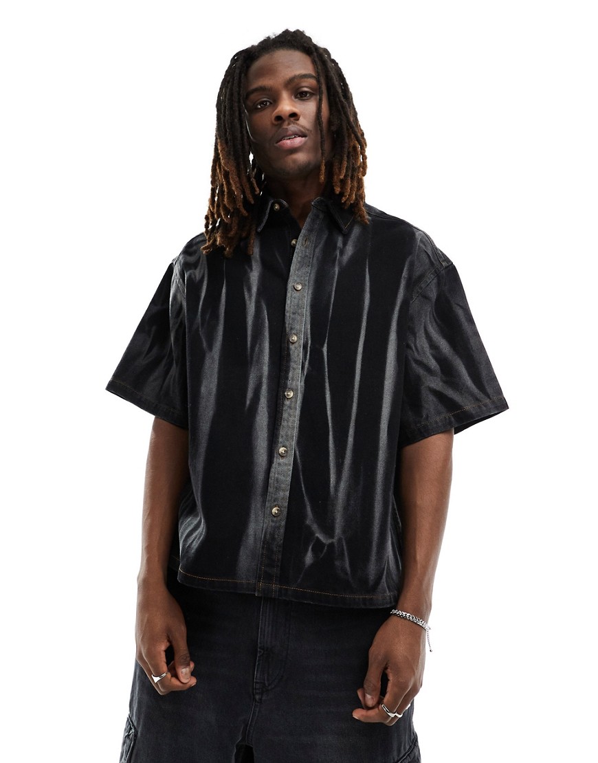 ASOS DESIGN boxy oversized short sleeve denim shirt with acid wash stripes in black