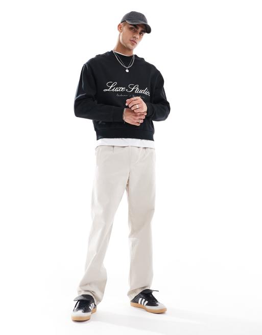 ASOS DESIGN boxy oversized sweatshirt with luxe studios print in black, 4 of 4