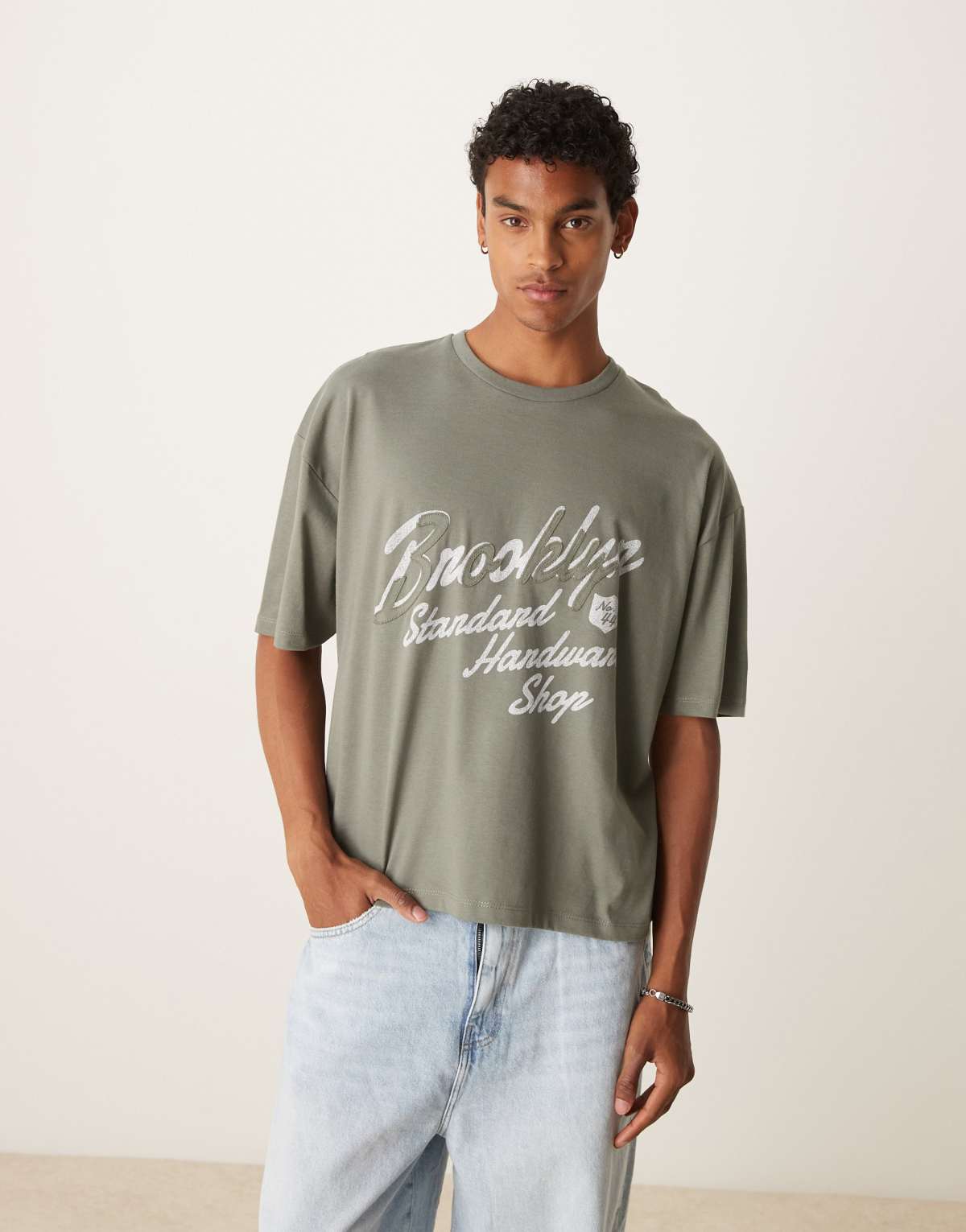 ASOS DESIGN boxy oversized t-shirt with city applique in khaki
