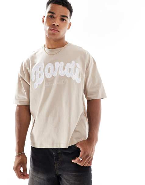 ASOS DESIGN boxy oversized t-shirt with city embroidery in washed beige - view 1