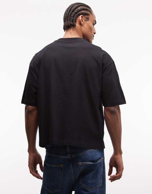 ASOS DESIGN boxy oversized t-shirt with cut and sew paneling and sports graphics in black, 4 of 5