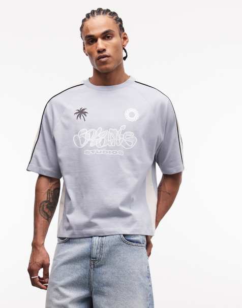 ASOS DESIGN boxy oversized t-shirt with football graphic in light blue - view 1