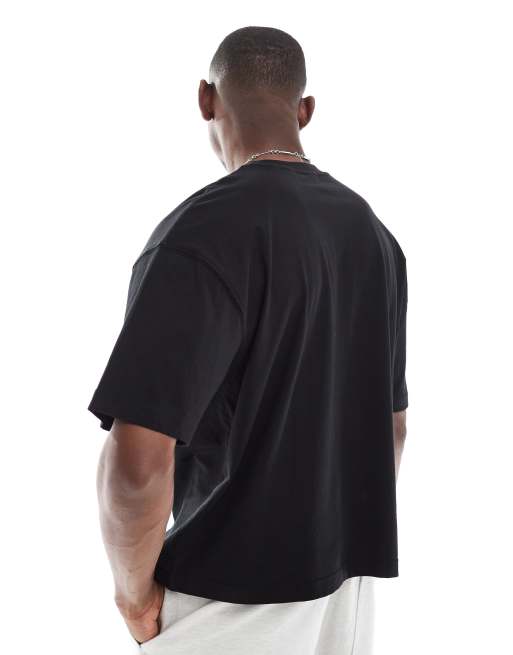 ASOS DESIGN boxy oversized T-shirt with running graphic in black