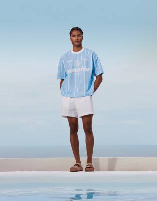 ASOS DESIGN boxy oversized t-shirt with sports graphic in blue stripe