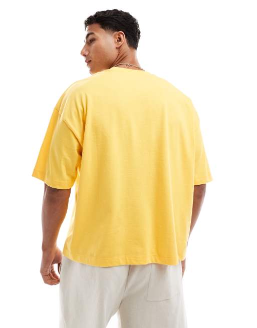 ASOS DESIGN boxy oversized T-shirt with street graphic in yellow