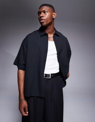 ASOS DESIGN boxy oversized textured shirt with snaps in black