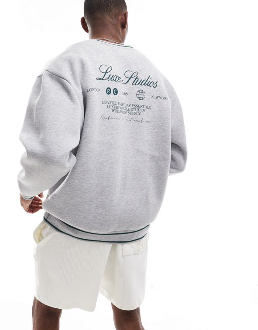 ASOS DESIGN boxy oversized v neck sweatshirt with luxe studios print in grey