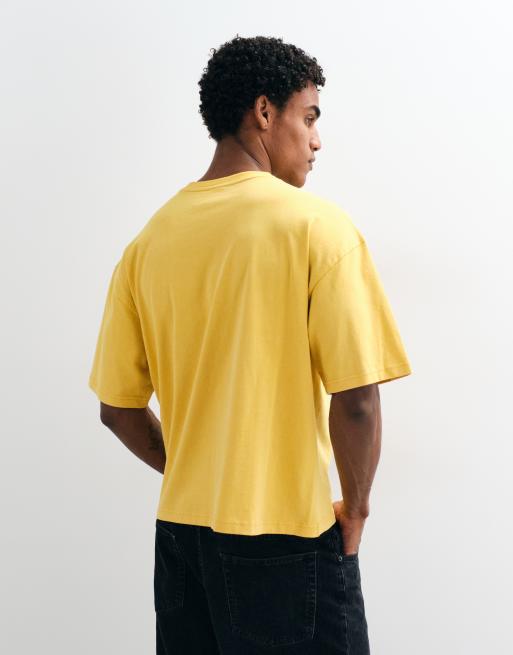 ASOS DESIGN boxy oversized washed t shirt with text graphic in yellow, 4 of 5