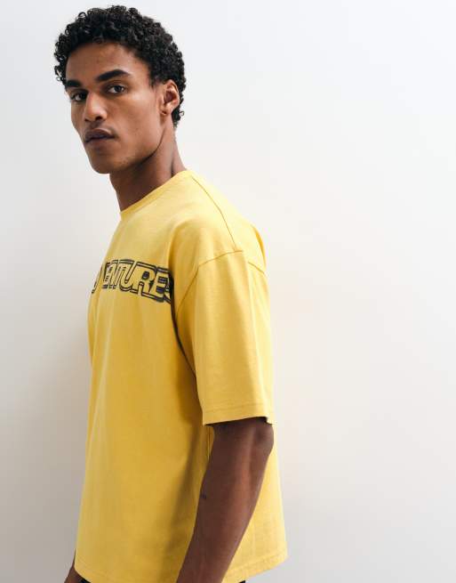 ASOS DESIGN boxy oversized washed t shirt with text graphic in yellow, 5 of 5