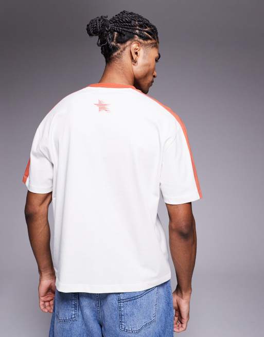 ASOS DESIGN boxy relaxed t-shirt with taping and sports graphic in cream and orange