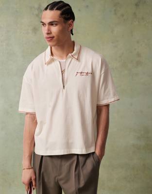 Asos Design Boxy Short Sleeve Polo Shirt With Chest Embroidery And Back Graphics In White