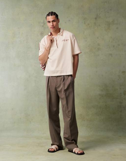 ASOS DESIGN boxy short sleeve polo shirt with chest embroidery and back graphics in off white