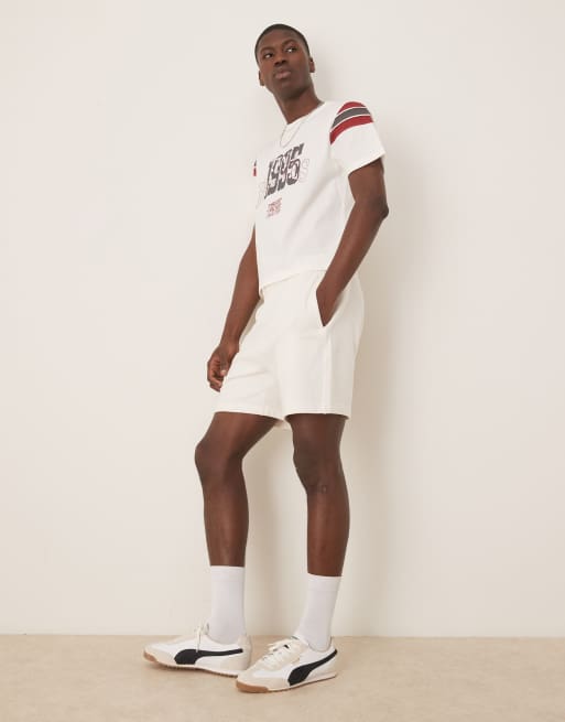 ASOS DESIGN boxy T-shirt with paneling and sports graphic in white