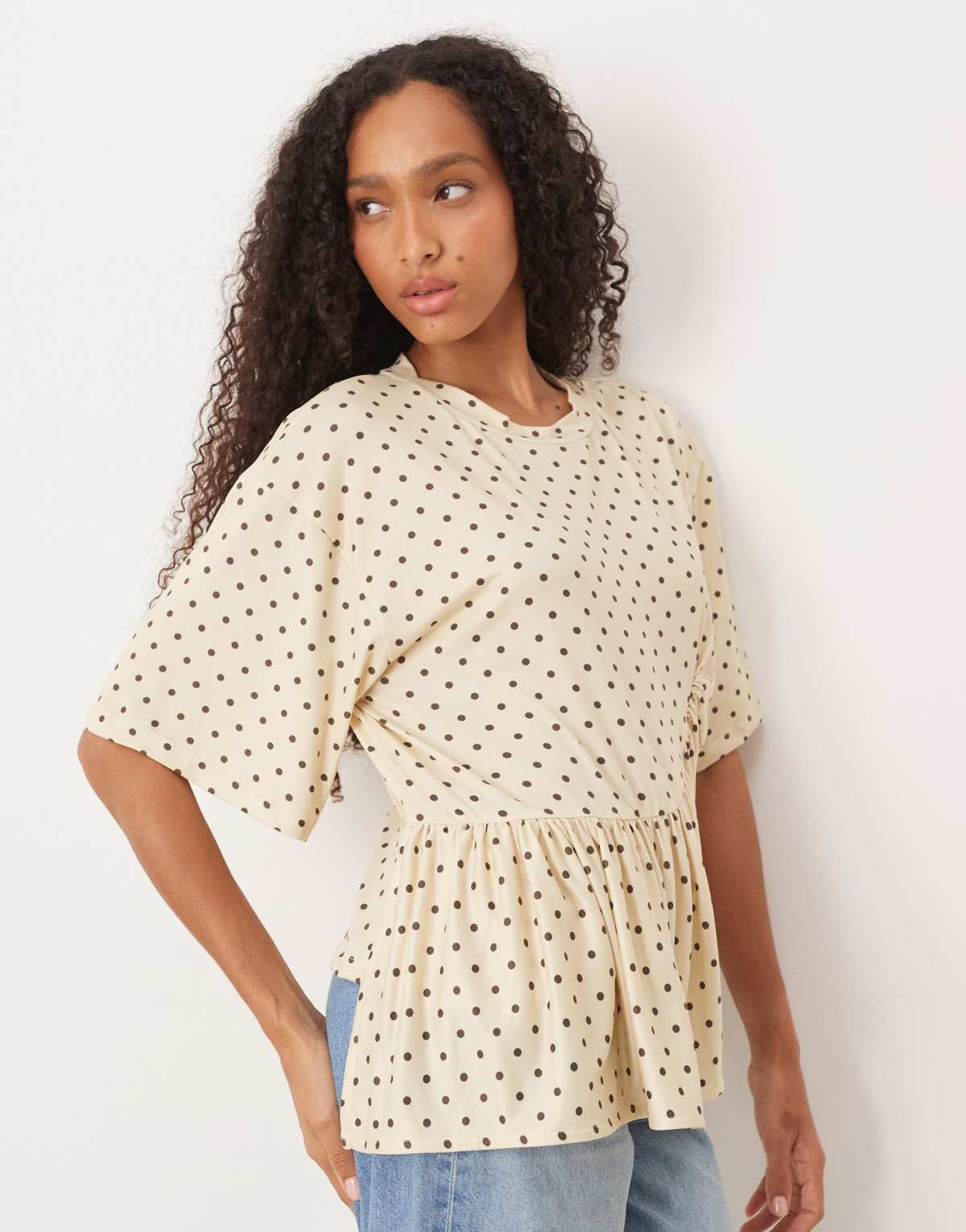 ASOS DESIGN boxy tee with asymmetric peplum hem in cream polka dot