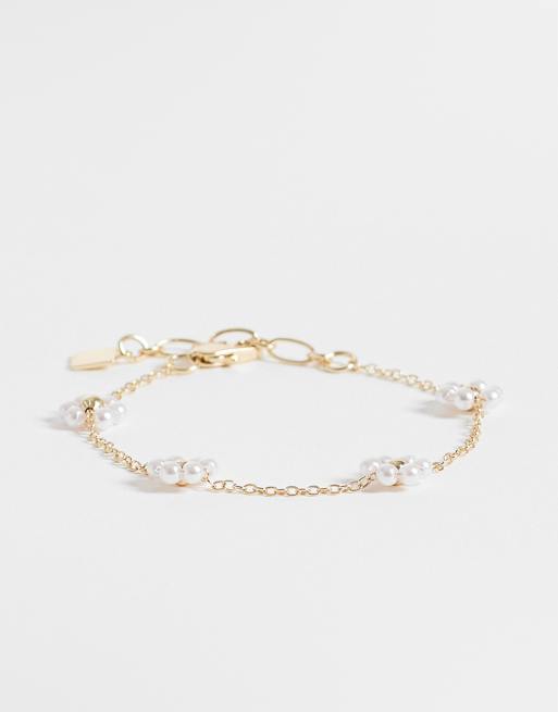 ASOS DESIGN - Bracciale color oro con fiori in perle sintetiche
