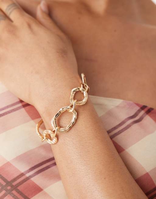ASOS DESIGN - Bracciale con catena spessa con cinturino a T zigrinato color oro