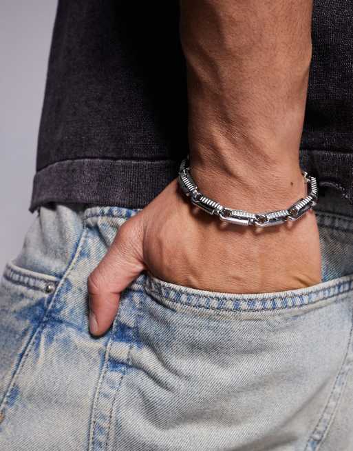 ASOS DESIGN - Bracciale da festival in acciaio inossidabile resistente all'acqua color argento con catena spessa e dettaglio in rilievo 