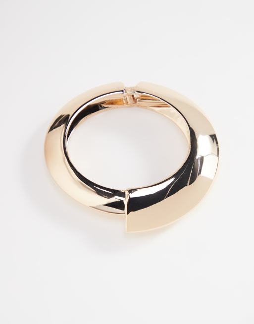 ASOS DESIGN - Bracciale rigido dorato con dettagli astratti