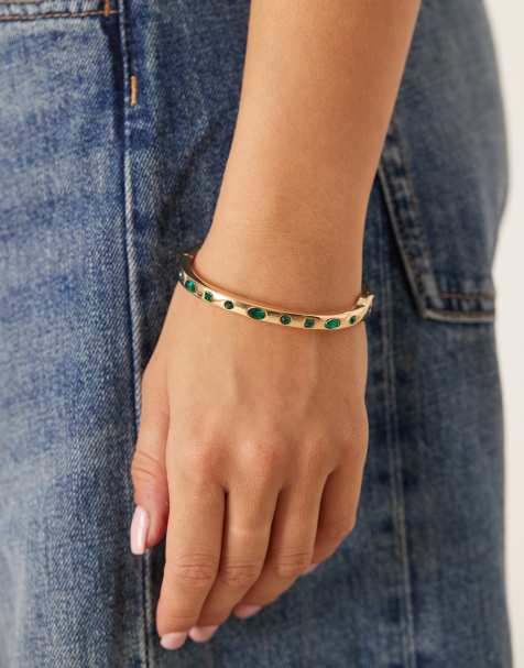 ASOS DESIGN - Bracciale rigido dorato con pietre verdi incastonate - view 1