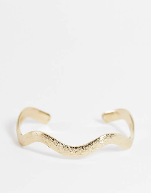 ASOS DESIGN - Bracciale rigido ondulato color oro