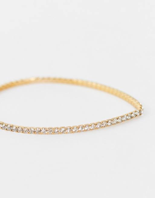 ASOS DESIGN - Bracciale stretch oro con cristallo