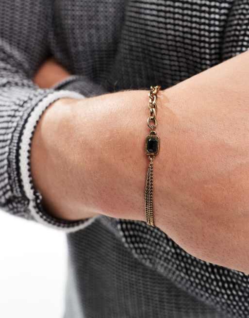 ASOS DESIGN - Bracelet chaîne à maillons variés avec pierre noire - Doré vieilli