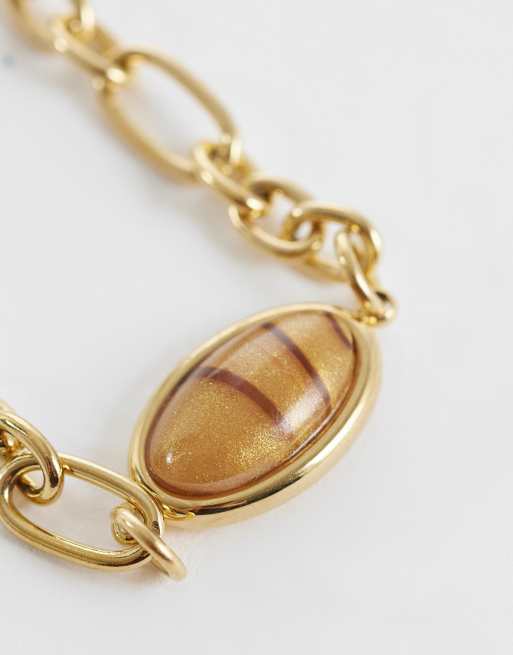 ASOS DESIGN - Bracelet en acier inoxydable résistant à l'eau avec pierre œil-de-tigre ovale - Doré, 2 de 3