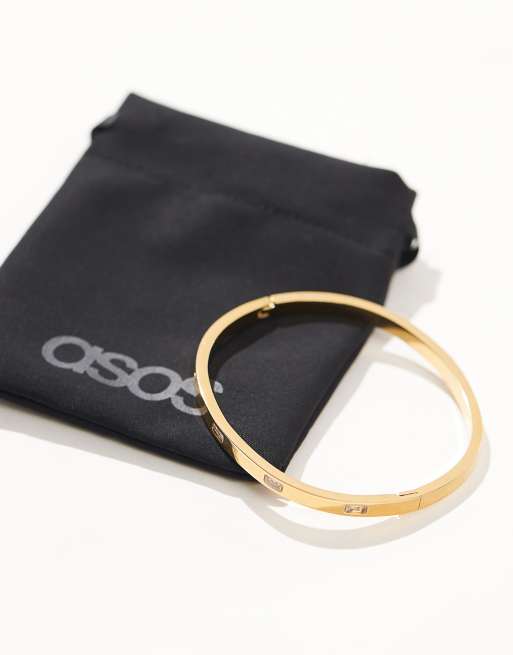 ASOS DESIGN - Bracelet jonc en acier inoxydable à détail baguette avec pochette cadeau - Doré