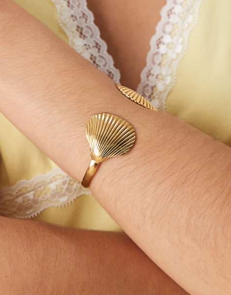 ASOS DESIGN - Bracelet jonc en acier inoxydable imperméable avec coquillages - Doré - view 1