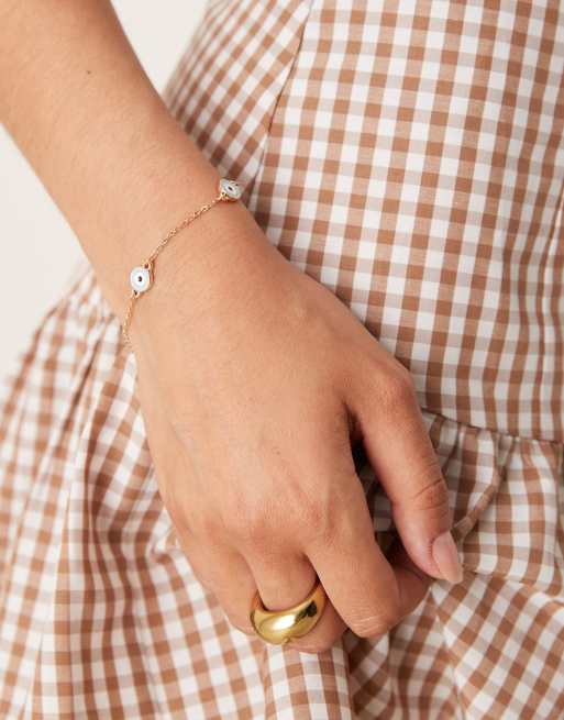 ASOS DESIGN - Bracelet simple à détail chaîne avec breloques yeux bleus - Doré, 3 de 3