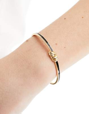 ASOS DESIGN - Bracelet style jonc avec breloque naud émaillé - Doré
