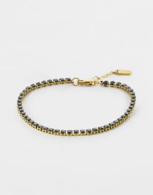ASOS DESIGN - Bracelet tennis en acier inoxydable résistant à l'eau à zircons cubiques noirs - Doré