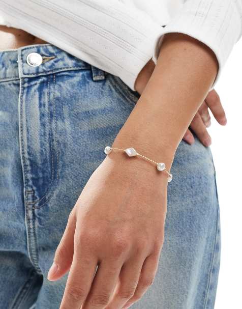 ASOS DESIGN bracelet with faux pearl and fine chain design in gold tone - view 1