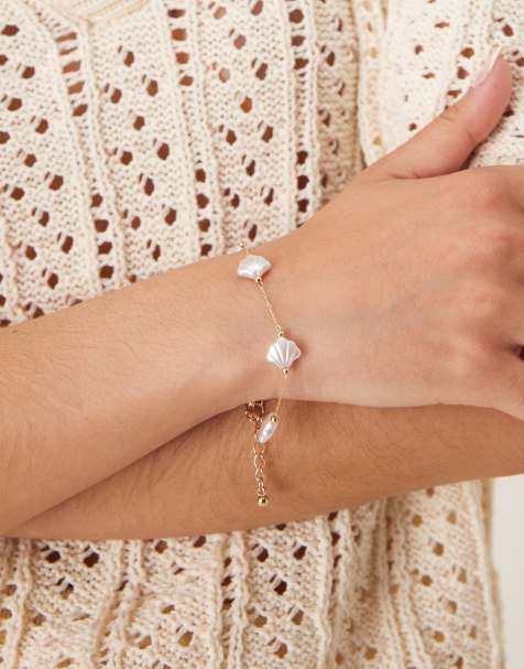 ASOS DESIGN bracelet with faux pearl shells in gold tone - view 1