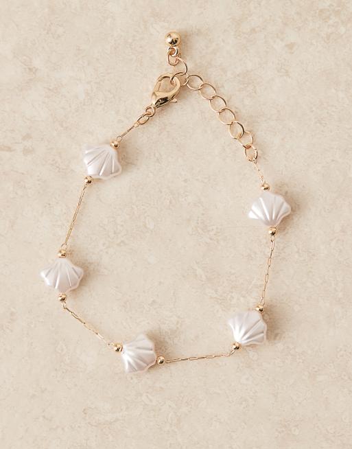 ASOS DESIGN bracelet with faux pearl shells in gold tone | ASOS