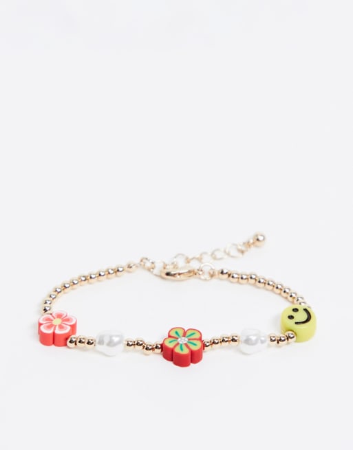 Asos Design Bracelet With Flower And Happy Face Beads In Gold Tone Asos