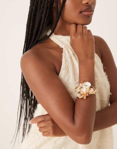 ASOS DESIGN bracelet with statement flower and faux pearls in gold tone - view 1