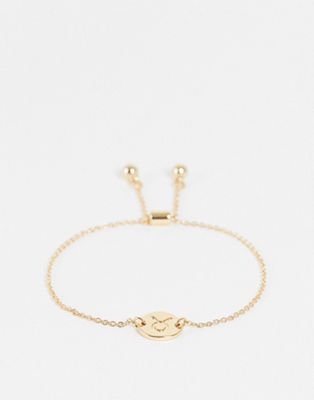 ASOS DESIGN bracelet with Taurus zodiac charm in gold tone