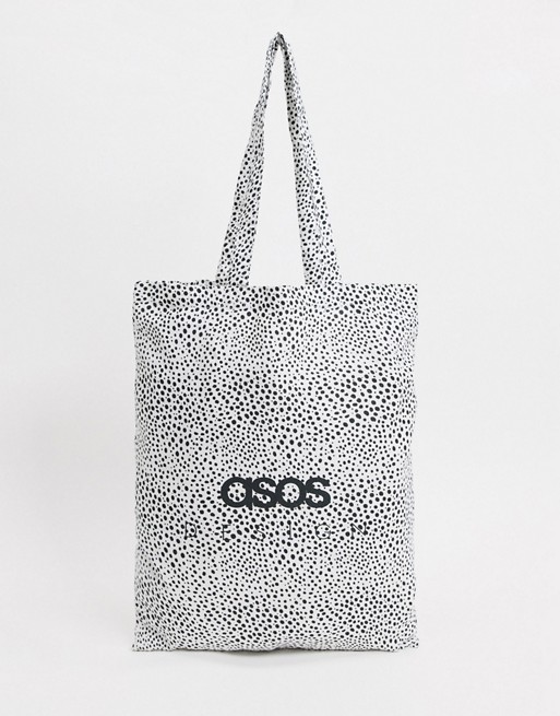 ASOS DESIGN branded organic cotton tote bag in mono spot print