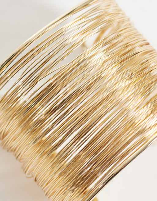 ASOS DESIGN - brazaletes rígidos de varios aros en tono dorado, 3 de 3