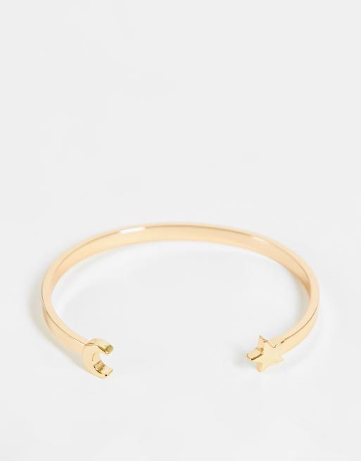 ASOS DESIGN - Brede armband met maan- en ster-ontwerp in goudkleur