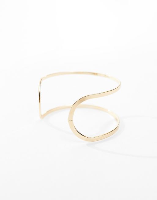 ASOS DESIGN - Brede armband met uitgesneden ontwerp in goudkleur