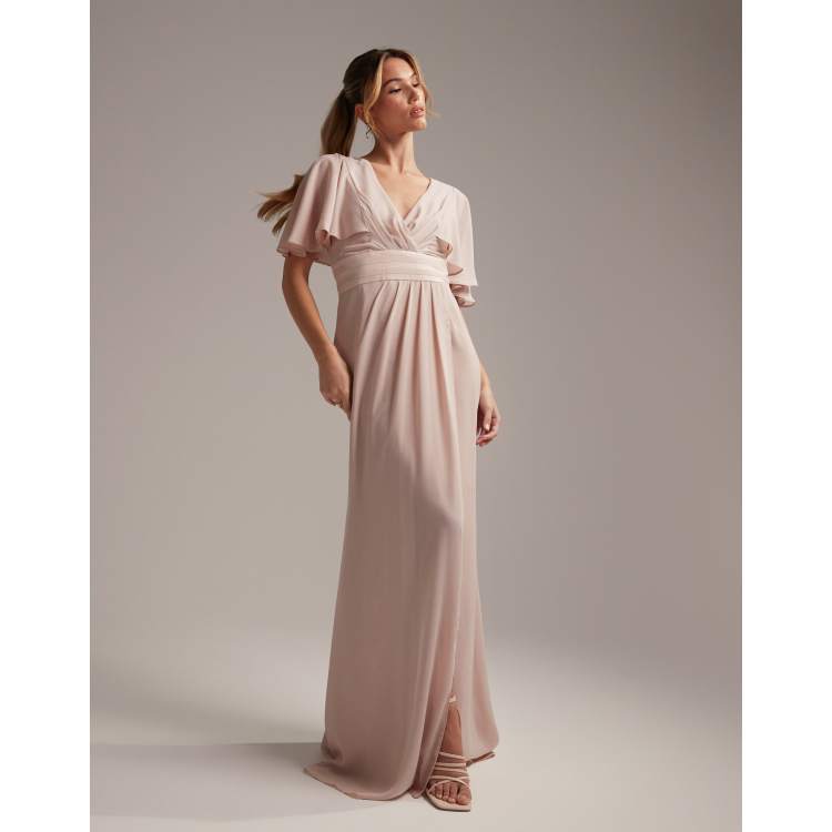 ASOS DESIGN Bridesmaid ruched bodice drape maxi dress with wrap waist and  flutter cape sleeve in blush - ShopStyle