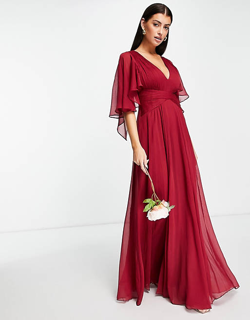 ASOS DESIGN Bridesmaid ruched bodice drape maxi dress with wrap waist and flutter cape sleeve in berry