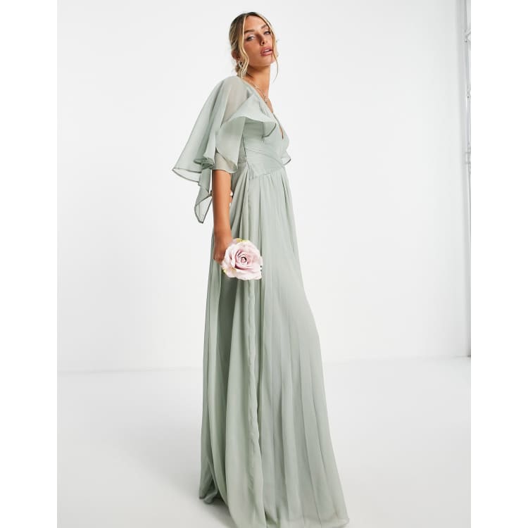 ASOS DESIGN Maternity Bridesmaid ruched bodice drape maxi dress with wrap  waist and flutter cape sleeve in blush