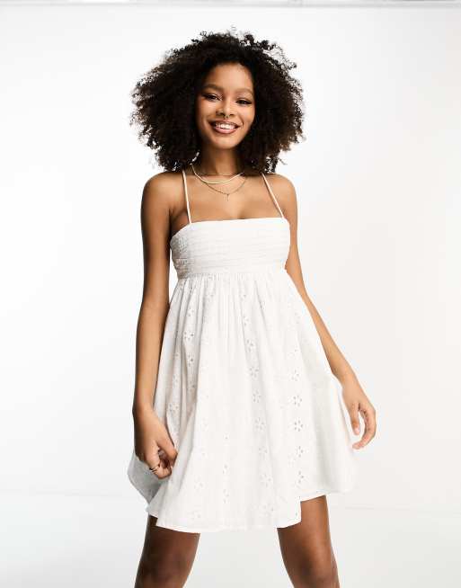 ASOS DESIGN pleated babydoll mini dress with oversized cutwork