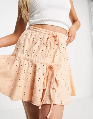 ASOS DESIGN ASOS DESIGN broderie tiered mini skirt with tie detail in apricot-Orange